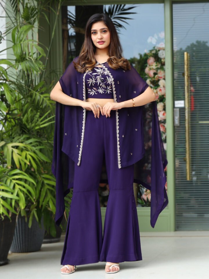 Organza Cape with hand embroidered detailing paired with a royal georgette hand embroidred bustier and flared pants