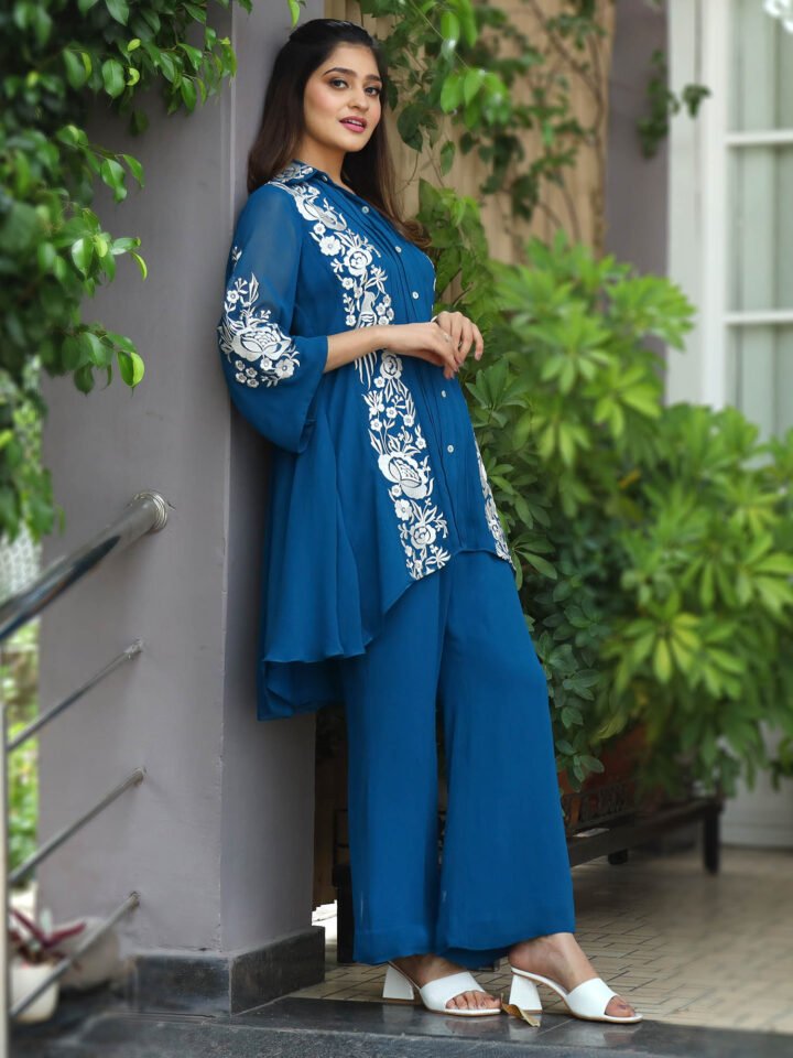 Royal Blue georgette tunic with thread embroidery detailing paired with georgette bell bottoms
