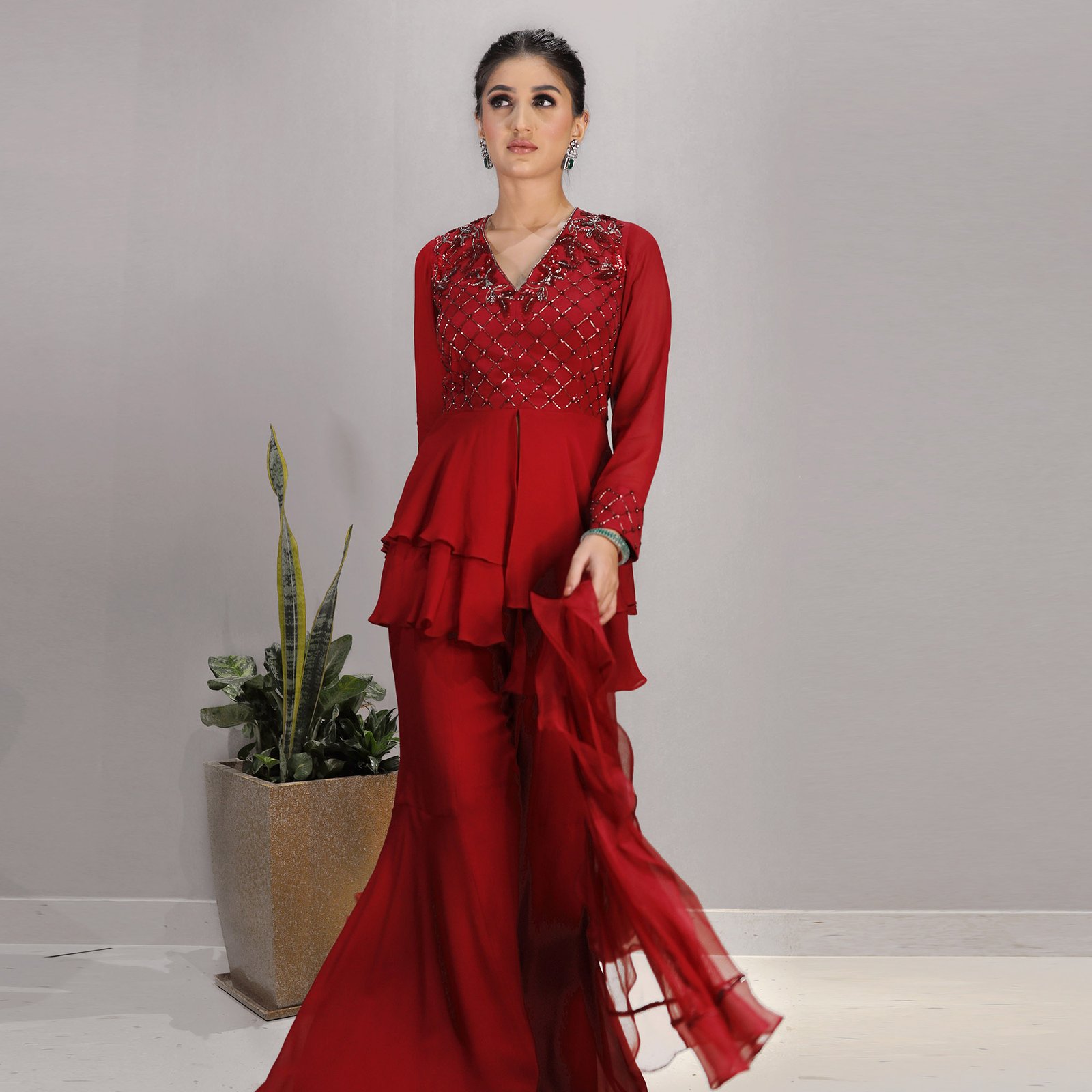 Red Layered peplum top with hand Embroidered yoke & our signature gharara bottom with a tulle & organza ruffled Dupatta