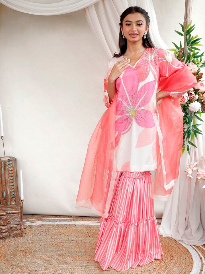 Printed suit with hand embroidered highlight details paired with layered gharara & organza dupatta