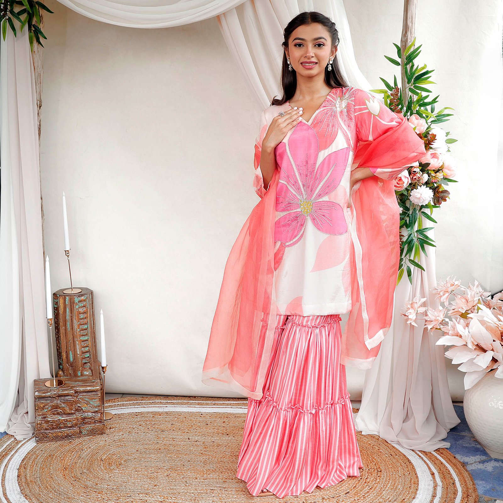 Printed suit with hand embroidered highlight details paired with layered gharara & organza dupatta